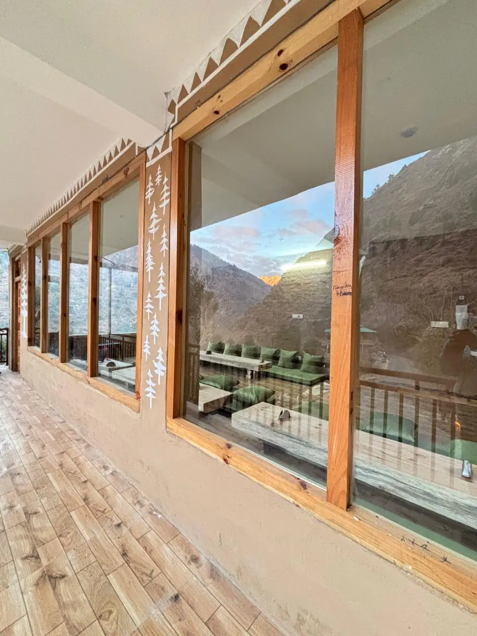 Cafe windows reflecting the mountains