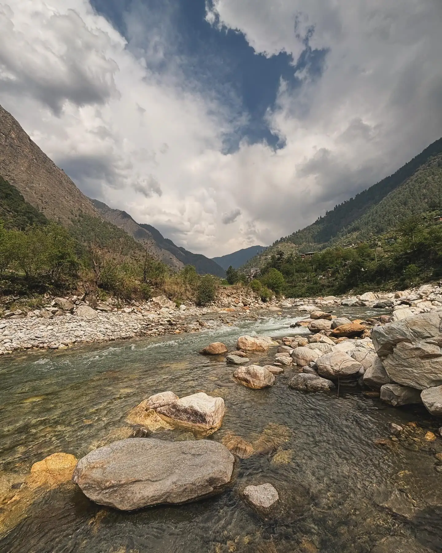 The Tirthan river winding through the valley